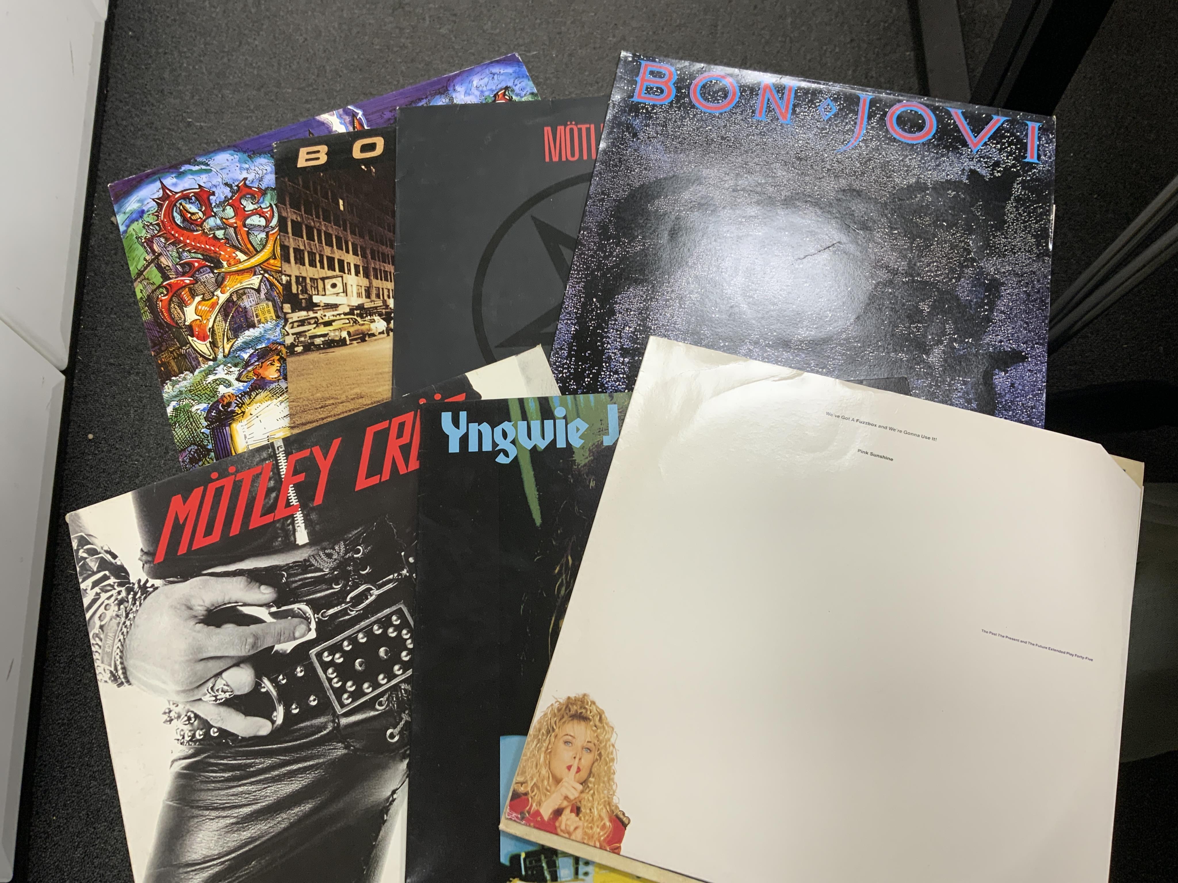 Sixty LP record albums, 12” singles, compilations, etc. artist including; Quireboys, Led Zeppelin, T’Pau, Mötley Crüe, Yes, Manic Street Preachers, Bon Jovi, etc. Condition - fair to good